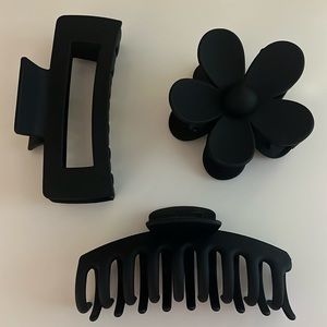 Three black claw clips